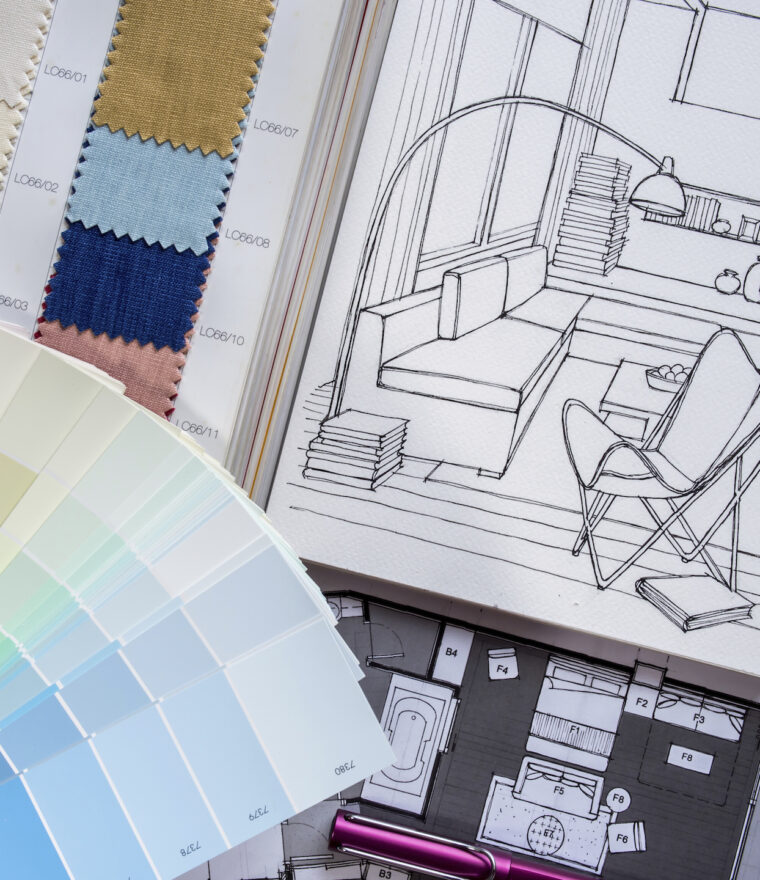 paint and fabric color samples placed beside interior decorating sketch drawings